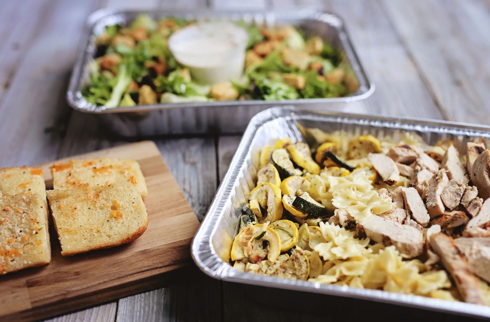 BD Catering trays of pasta, salad, and bread