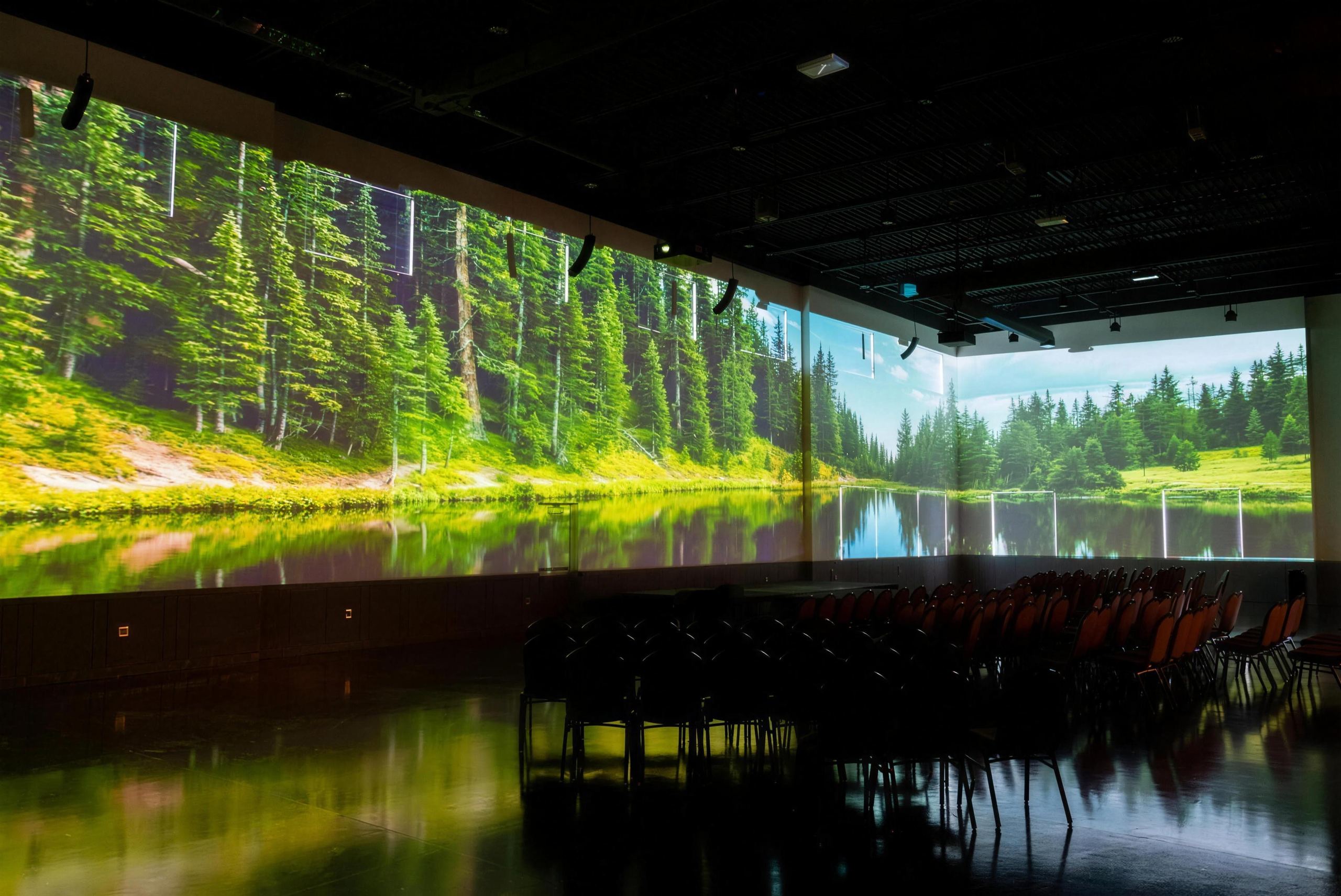 Warehouse 22 hall with a forest lake projected across the walls