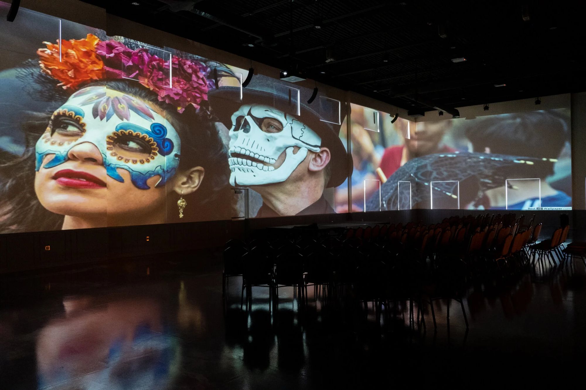 Colorful art projected across the Warehouse 22 walls